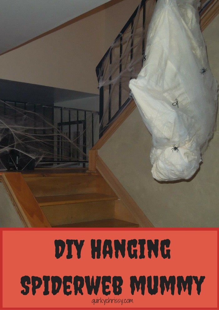 I made a homemade hanging mummy cocoon wrapped in spider webs and hung it from the banister in the stairwell for our Halloween Party