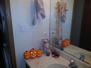 Bloody hand print on the mirror-scary Halloween bathroom decor