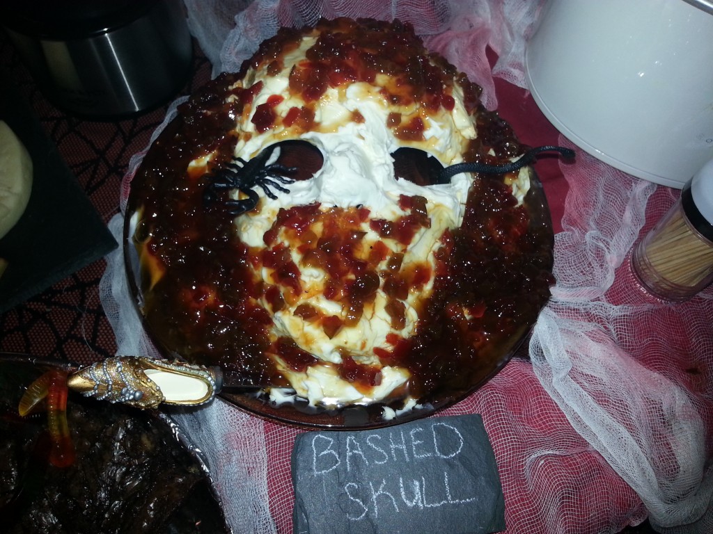 Bashed Skull: A plain mask that I got at Michael's painted in cream cheese and covered with jalapeno jam. Serve with crackers. I don't know why, but no one wanted to eat this one.