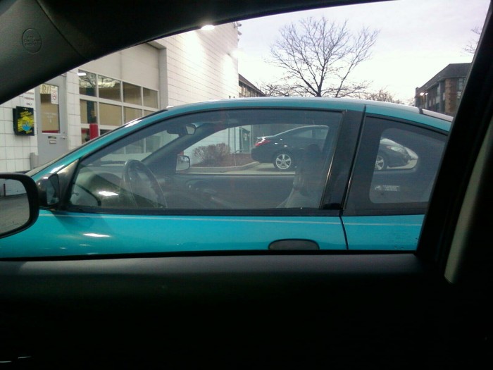 This is what it looks like to say goodbye to your beloved car from the driver's seat of your new car.