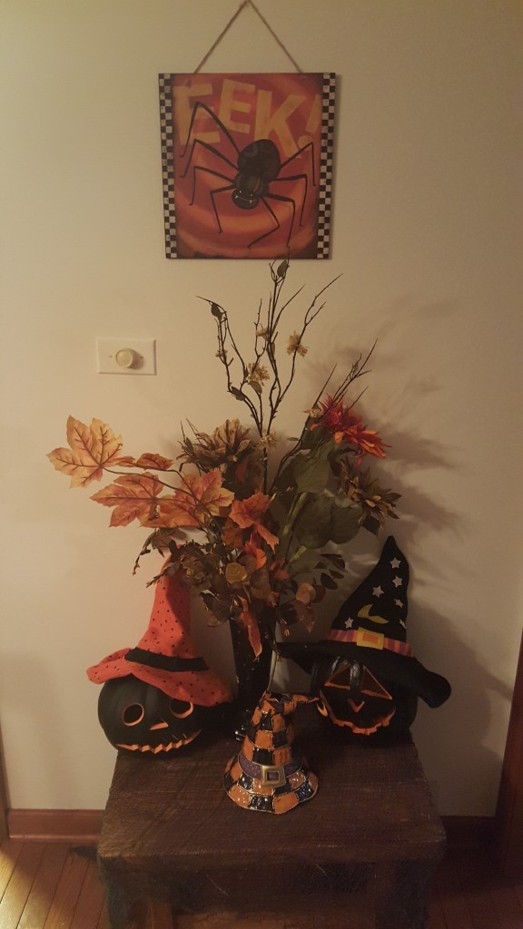 I love this display of light-up electric pumpkins with witches hats, creepy cloths and fall foliage