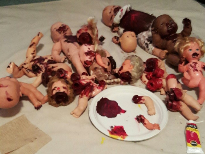 I decided to make a lot of bloody, creepy doll parts, using the blue doll as the cannibal leader doll, a few full size dolls and a lot of doll parts.