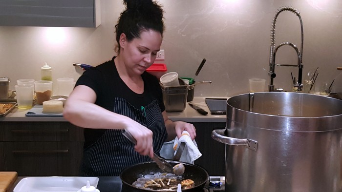 Chef Stephanie Izard prepares shrimp at a demo for Canadian Lentils