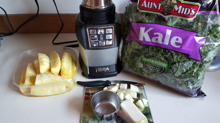 I made a Kale Smoothie with my Nutri Ninja using kale, pineapple slices, and pears.