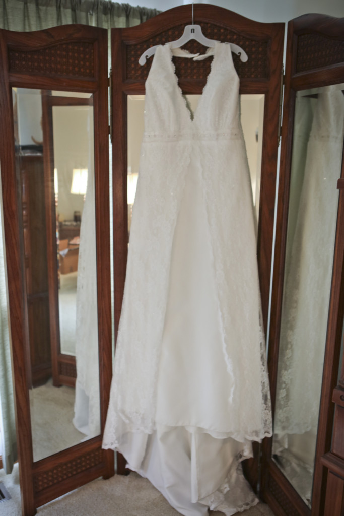 I love this wood tri-fold standing mirror in my bedroom. It was the perfect spot to hang my wedding gown.