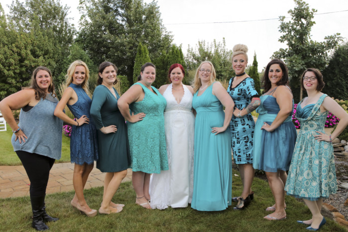 Standing with my something blue crew, all wearing teal dresses