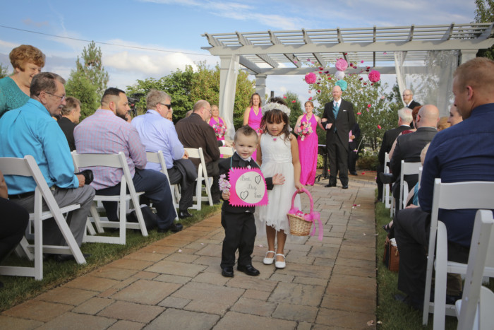 The ring bearer and flower girl walking back up the aisle