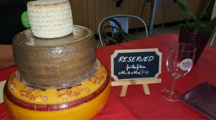 Our wedding cake was three tiered cheese wheels. This was the demo from Whole Foods.