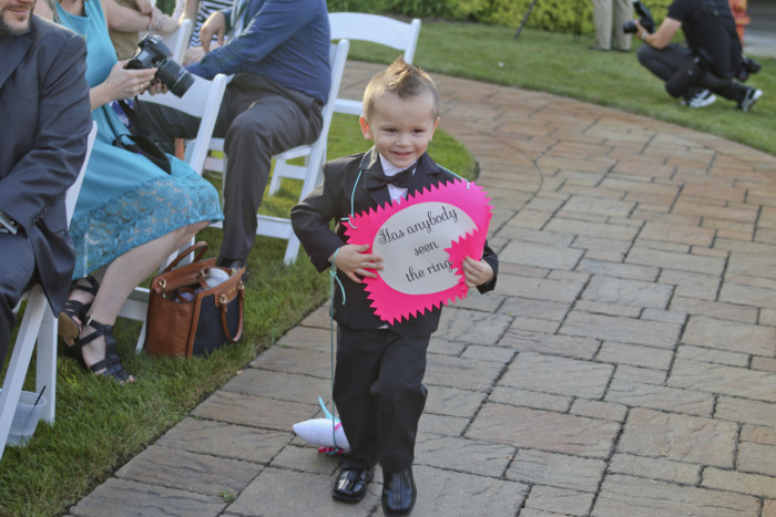 Our ring bearer had a sign that said "Has anybody seen the rings?" and dragged the ring pillow behind him.