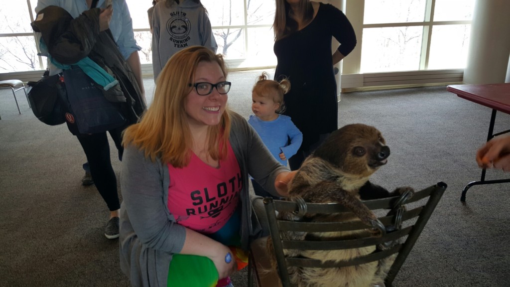 Quirky Chrissy petting the adorable Steve the Sloth.