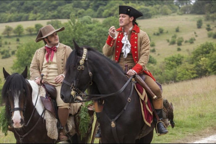 Gaston and Lefou riding horses