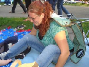 Chrissy falling out of her camp chair at the Backstreet Boys concert