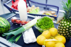 Group of food products on supermarket checkout