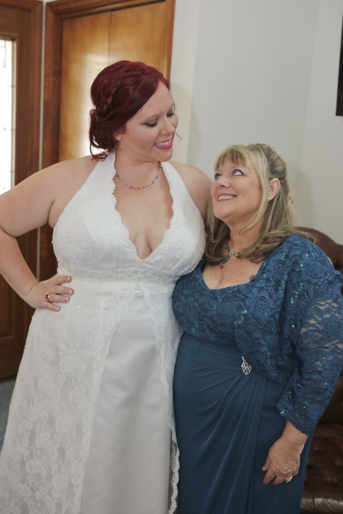 funny professional wedding photos Chrissy and her mom making faces at each other