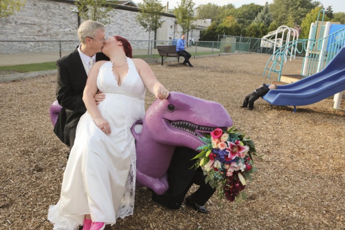 hilarious professional wedding photos  at a playground