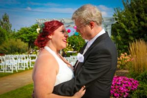 Bride and groom smiling at each other