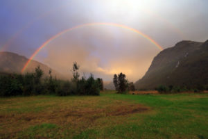 Rainbow after rain over mountain