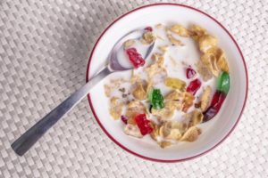 Gummy worms and bears in a bowl of cereal