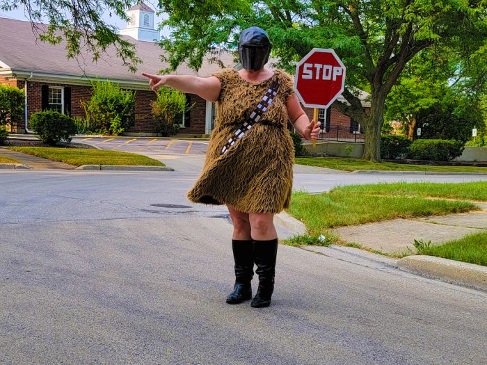 Mandolorian Wookie Woman with a stop sign