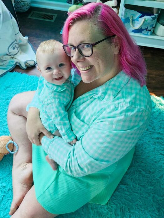 Mama and baby matching Aqua Check Button-Down Thrifted Shirts sitting in aqua nursery