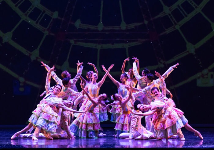 The Nutcracker The Joffrey Ballet Ensemble in colorful costumes with a black backdrop