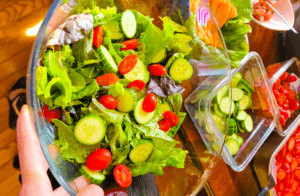 Fresh greens salad with cucumbers and tomatoes